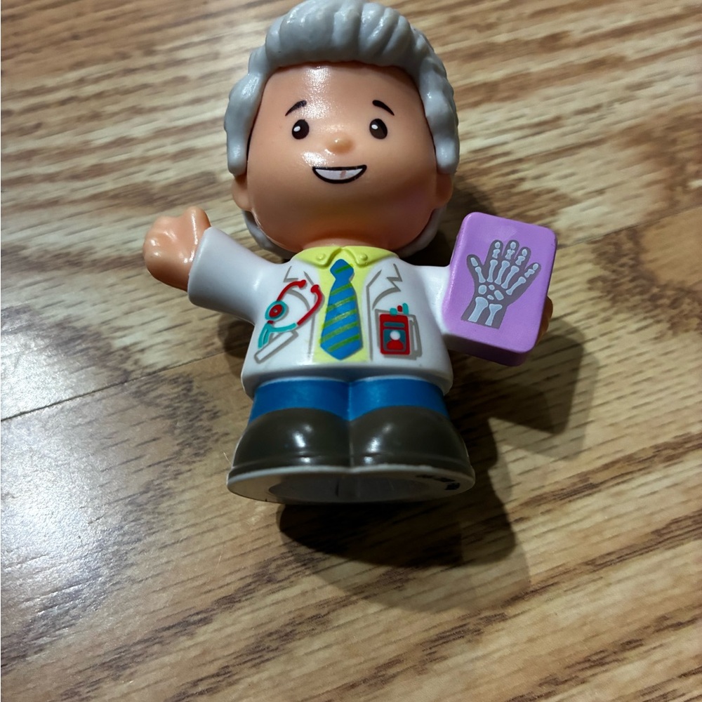 Fisher-Price Little People Doctor Figure in White Coat with Purple X-Ray Book